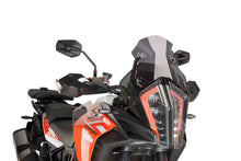Load image into Gallery viewer, PUIG Racing Dark Smoke Windscreen for motorcycle, featuring tinted, aerodynamic windshield with branding details visible.