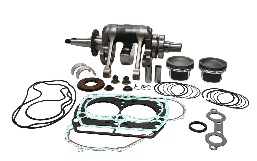 ProX Racing Parts engine rebuild kit Pol 19-EK5805C with pistons, gaskets, and engine components laid out for motorcycle engine repair