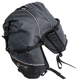 Giant Loop Great Basin Saddlebag 68L in black attached to motorcycle luggage rack for outdoor adventure riding.