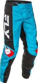 Fly Racing F-16 motocross pants in cyan, black, and white size 36 showing reinforced knee panels and breathable fabric.