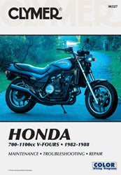 Clymer repair manual for Honda 700-1100 V4 engine, showing detailed diagrams and instructions on the open pages.