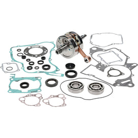 Hot Rods Bottom End Kit Hon 421-0020 engine components, including crankshaft, bearings, and pistons, arranged on a workbench.