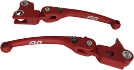 Flo Motorsports MX style lever set in red for Harley Davidson FXD models from 1996 to 2017, showing close-up of the levers on motorcycle handlebar.