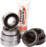 Load image into Gallery viewer, Pivot Works front wheel bearing kit 52-0415 for drive applications, includes bearings and components for wheel assembly repair.