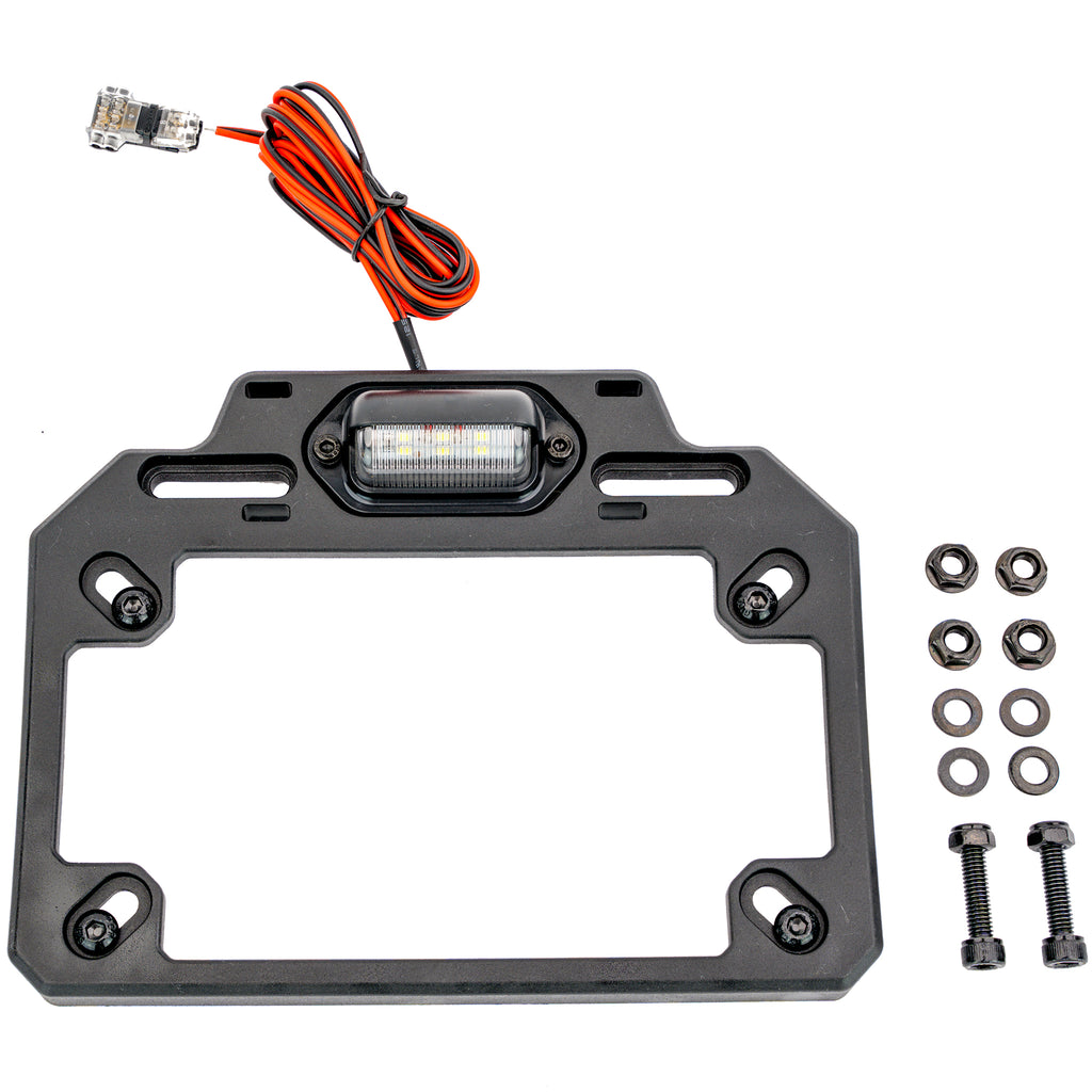 ATV-TEK adjustable license plate bracket with integrated LED light for ATV or motorcycle, mounted on vehicle with visible mounting hardware.