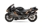 Yoshimura Race R77 slip-on exhaust with stainless steel and carbon fiber finish on a motorcycle.