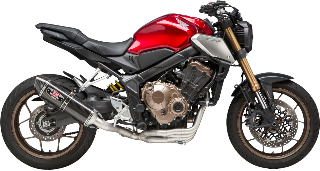 Yoshimura R-77 Race exhaust system in stainless steel and carbon fiber for Honda motorcycles, shown from side view.