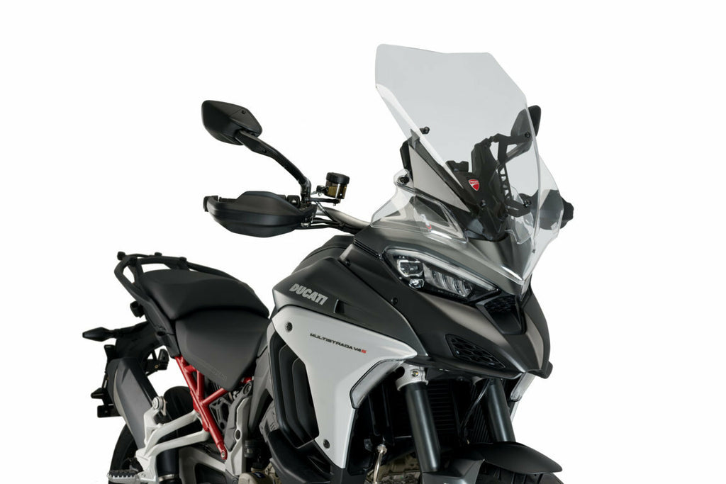 Clear PUIG touring motorcycle windshield, designed for Ducati models, provides wind protection and improved aerodynamics.