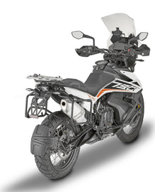 GIVI side case hardware and fasteners for motorcycle luggage, shown in a close-up image with mounting fittings.