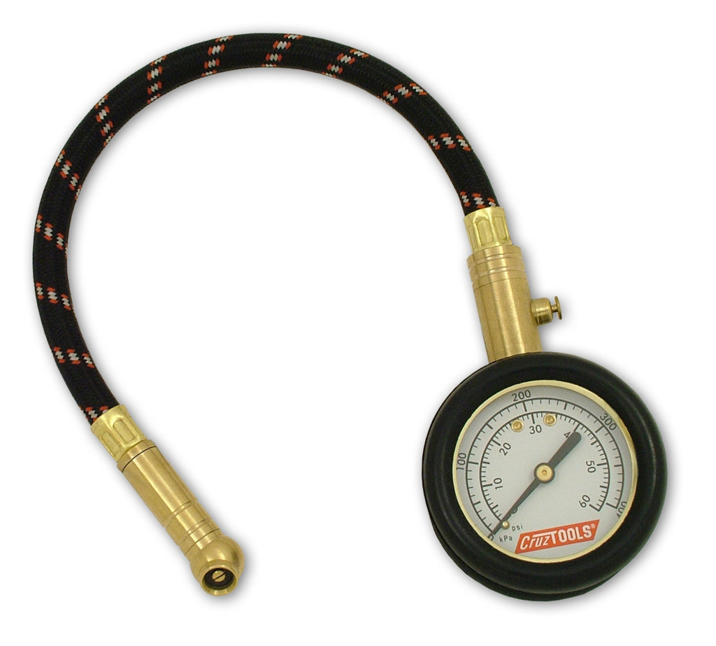 Cruztools Tirepro Dial Tire Gauge 57-0011, a handheld tool with a dial for measuring tire pressure accurately.