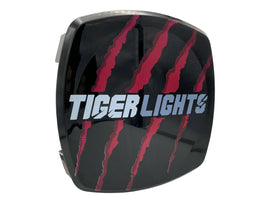 Tiger Lights lens cover with logo, designed for illumination, showcasing a sleek black finish and branded Tiger Lights logo.
