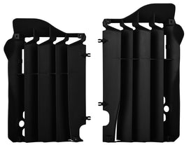 Polisport Plastics black radiator louvers with product code 64-56537, mounted on a vehicle's radiator for airflow protection.