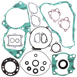 Vertex Complete Gasket Set with Oil Seals, including multiple gaskets and seals for engine repair, laid out on a flat surface.