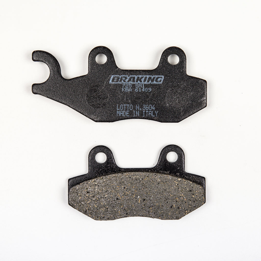 Braking semi-metallic brake pad set 31-725S for vehicle braking system, showing multiple brake pads with metal backing plates.