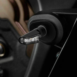 Pair of RIZOMA Leggera black turn signals with sleek design, featuring compact, modern style for motorcycle lighting.