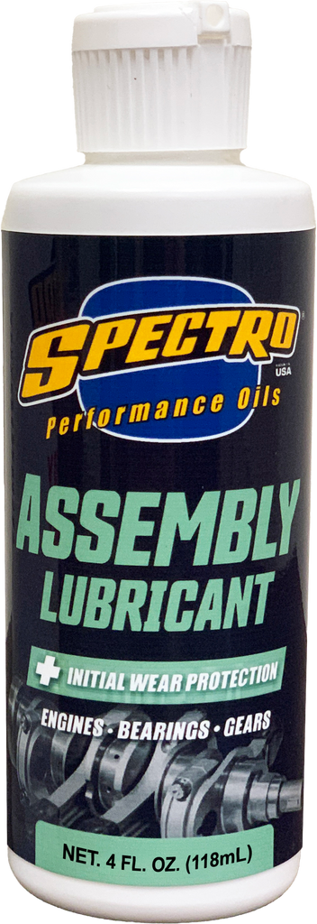 Spectro assembly lube 4oz bottle of chemical product with white cap and label, used for engine or machinery assembly.