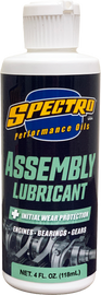 Spectro assembly lube 4oz bottle of chemical product with white cap and label, used for engine or machinery assembly.