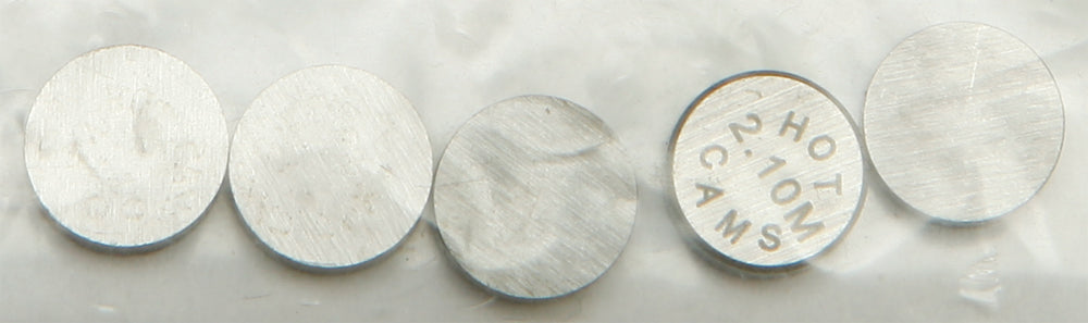 Hot Cams valve shims, 7.48x2.10mm, engine parts, 5-pack, featuring metal shims for motorcycle valve adjustments.