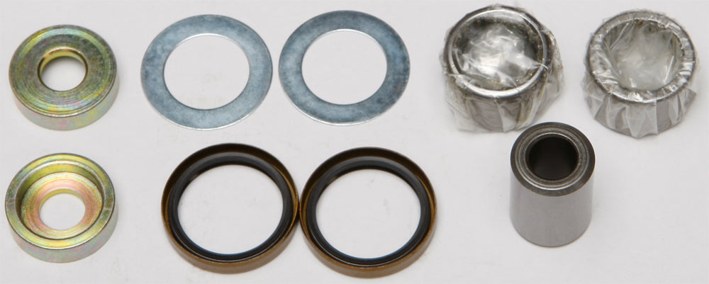 All Balls lower shock bearing and seal kit for suspension, showing components like seals and bearings in a clean workshop setting.