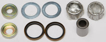 Load image into Gallery viewer, All Balls lower shock bearing and seal kit for suspension, showing components like seals and bearings in a clean workshop setting.