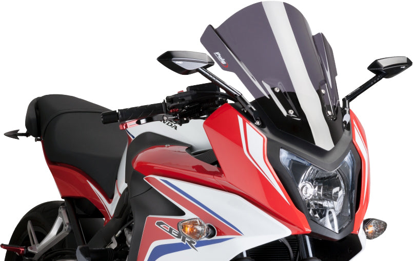 PUIG touring dark smoke windscreen for motorcycle, clear tinted windshield with aerodynamic design and mounting brackets.