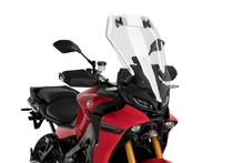 Load image into Gallery viewer, Clear Puig windshield with visor for Yamaha touring motorcycle, showing transparent windscreen and attached visor in natural light.