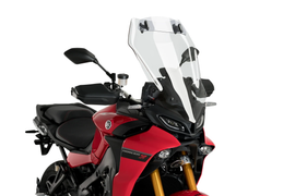 Clear Puig windshield with visor for Yamaha touring motorcycle, showing transparent windscreen and attached visor in natural light.
