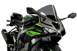 PUIG R-Racer dark smoke motorcycle windshield for Kawasaki, with sleek tinted design and aerodynamic shape.