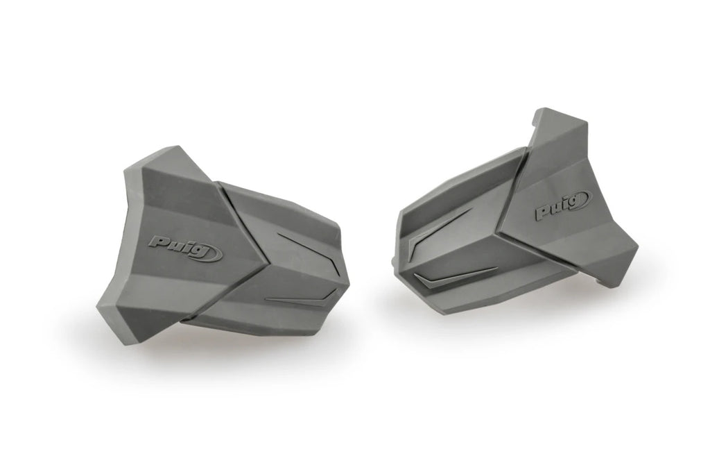 Pair of grey PUIG rubber end replacement frame sliders for R19 motorcycle, showing close-up of sliding components and mounting points.