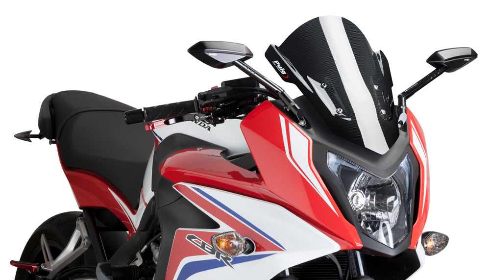 PUIG Racing Carbon Look Windscreen for motorcycle, featuring sleek black carbon finish and aerodynamic design.