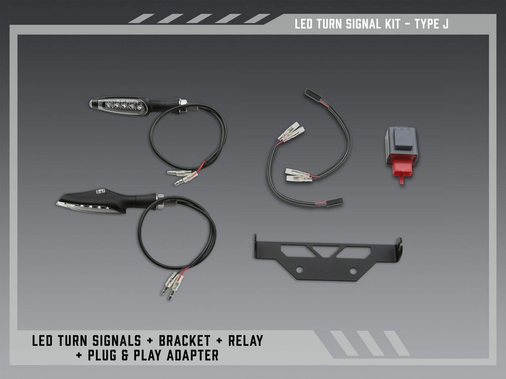 Yoshimura Fe V2 standard LED turn signal kit mounted on a vehicle body, showcasing clear lenses and sleek design.