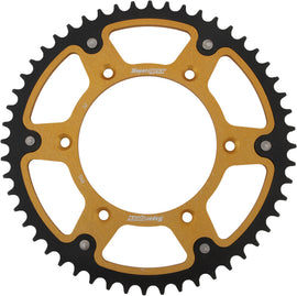 Supersprox rear stealth aluminum and steel 52-tooth motorcycle sprocket for Husqvarna and KTM bikes, gold color with detailed teeth design.