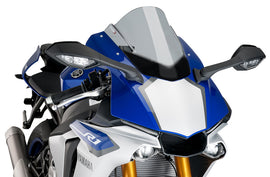 PUIG Racing Smoke Windshield for motorcycle, sleek black windscreen with tinted racing finish, designed for aerodynamic performance.