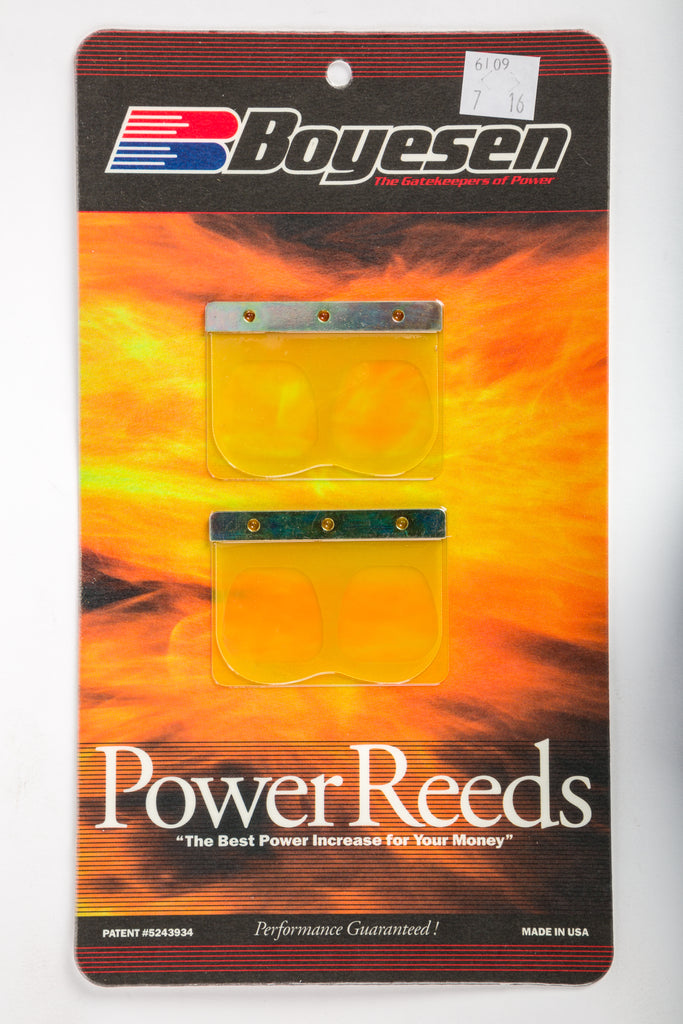 Boyesen motorcycle intake reeds 59-6109 installed in a carburetor for fuel system performance.