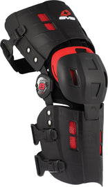 EVS Rs8 knee braces in size M, black protective safety gear with adjustable straps and reinforced padding for knee support.