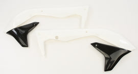 Acerbis radiator shrouds in white and black, designed for motorcycle cooling system, featuring sleek aerodynamic styling.
