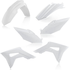 Acerbis white plastic kit for motorcycles, showing various plastic panels and parts on a flat surface.