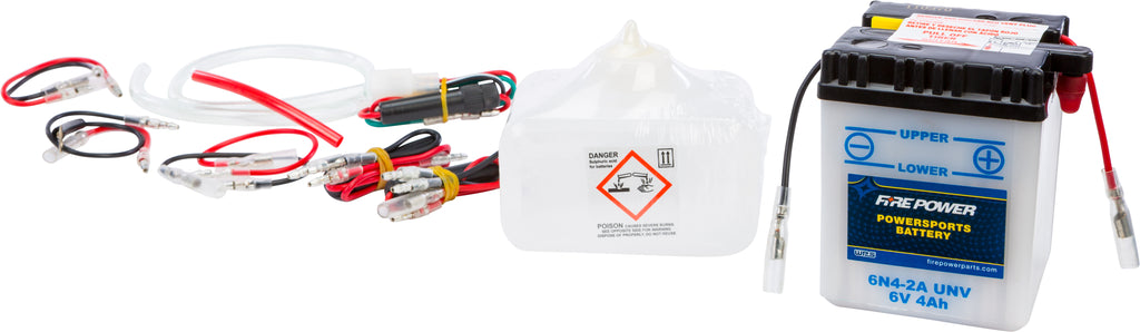 Fire Power 6V battery with acid, model 6N4-2A Unv 490-2021, showing the battery with labels and terminals.