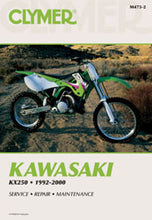 Load image into Gallery viewer, Clymer Kawasaki KX250 repair manual, showing detailed pages with diagrams and instructions for motorcycle maintenance.