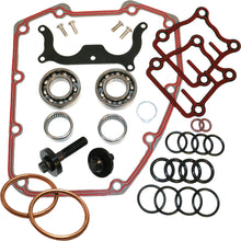 Load image into Gallery viewer, Feuling engine camshaft install kit with multiple engine components, including gears and camshafts, laid out on a surface.