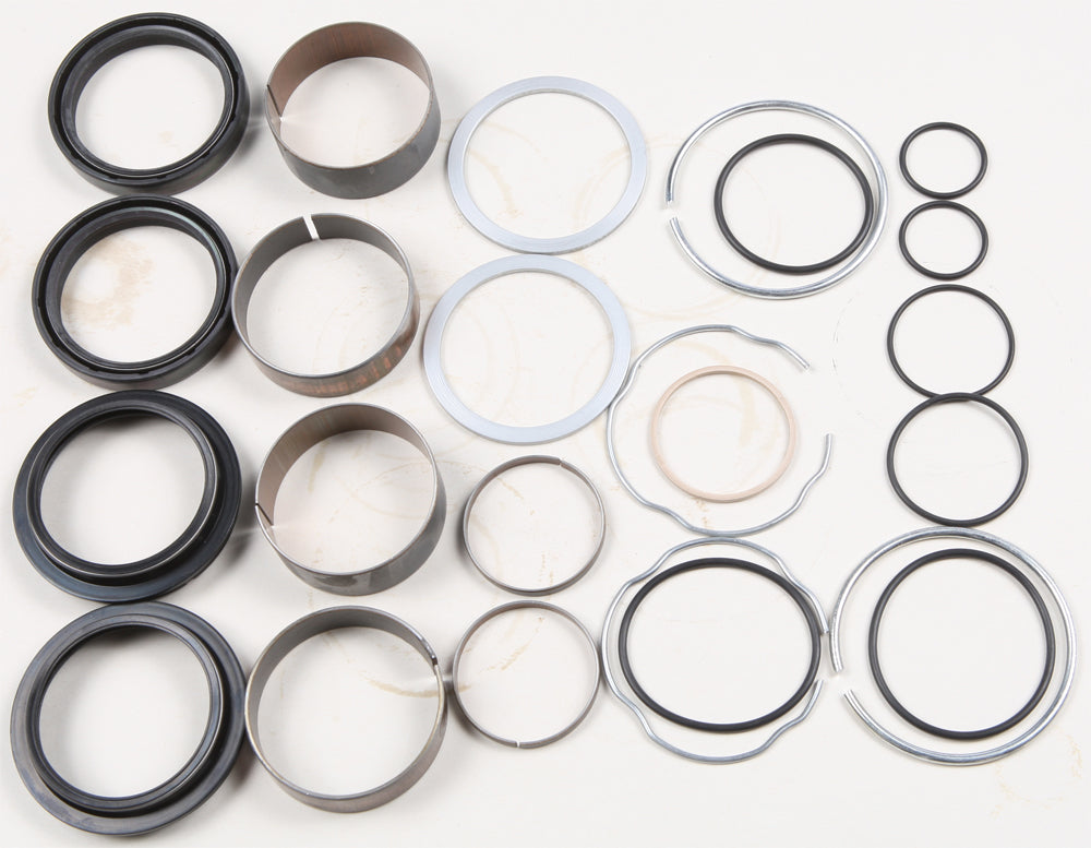 Pivot Works suspension seal and bushing kit for forks, featuring various seals and bushings arranged for installation.