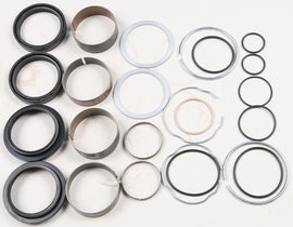 Pivot Works suspension seal and bushing kit for forks, featuring various seals and bushings arranged for installation.