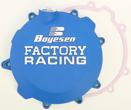 Boyesen Factory Racing clutch cover in blue, designed for high-performance motorcycles, featuring durable construction and branding.