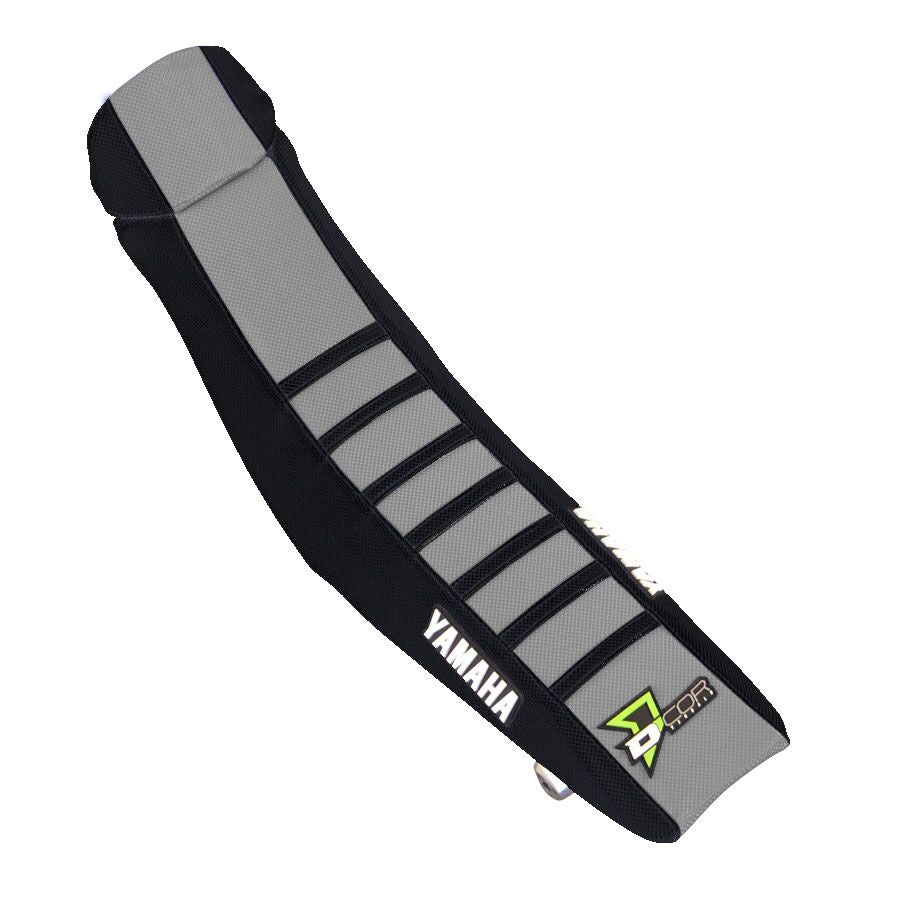 Black and grey DCOR seat cover with ribbed design, fits Yamaha YZF250 and YZF450 motocross bikes.