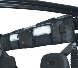 Black Classic Accessories UTV roll cage organizer with multiple storage compartments attached to a vehicle roll cage.
