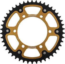 Supersprox rear stealth aluminum and steel 46-tooth off-road sprocket for Honda and Yamaha motorcycles, gold finish, installed on bike