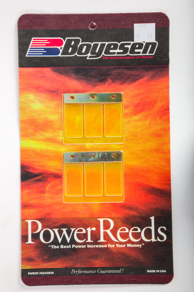Boyesen motorcycle intake/reed system with metal reeds and plastic frame, designed for enhanced engine performance.