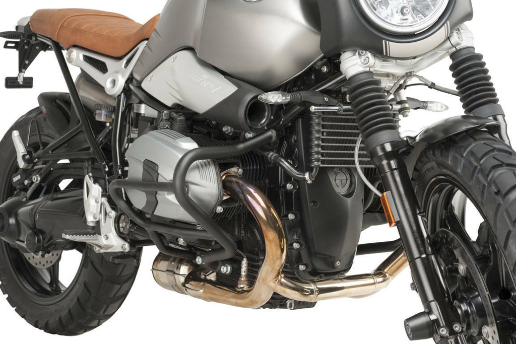 Black PUIG engine guards for BMW, body protection components with mounting points visible on the engine area.