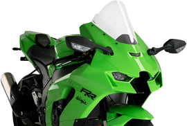 Clear PUIG Z-Racing windshield for Kawasaki Z; aerodynamic motorcycle windscreen shown on a bike.