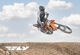 Fly Racing Wall Sign 2021 Lite-Ktm452 featuring bold graphics and branding, designed for motorcycle enthusiasts and decor.